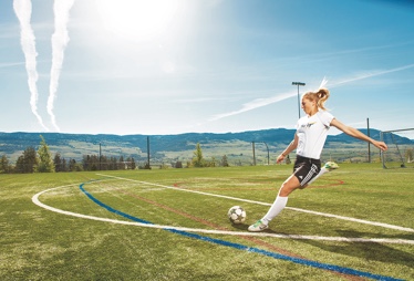 student playing soccer