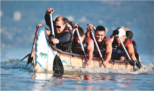 UBC students rowing longboat