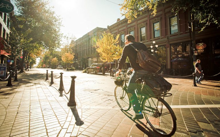 UBC student cycling in downtown Vancouver