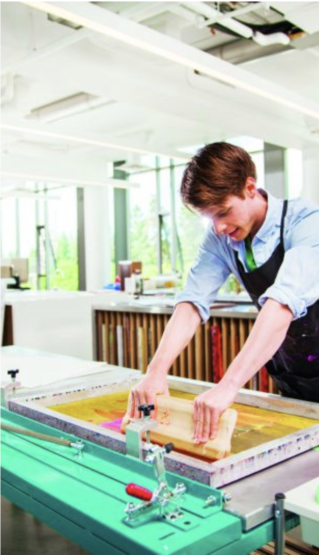 A Fine Arts student screen printing