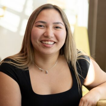Richelle smiling on the stairs at UBC Okangan