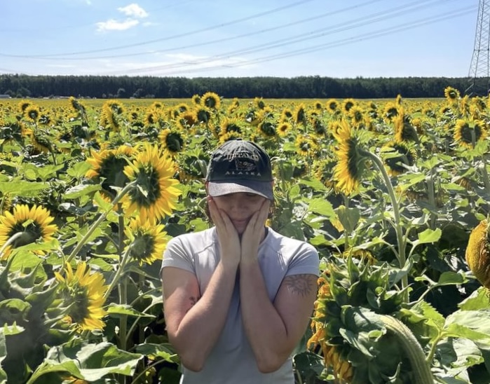 Emily P. in a sunflower field
