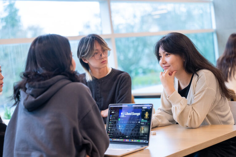 Students studying with a laptop