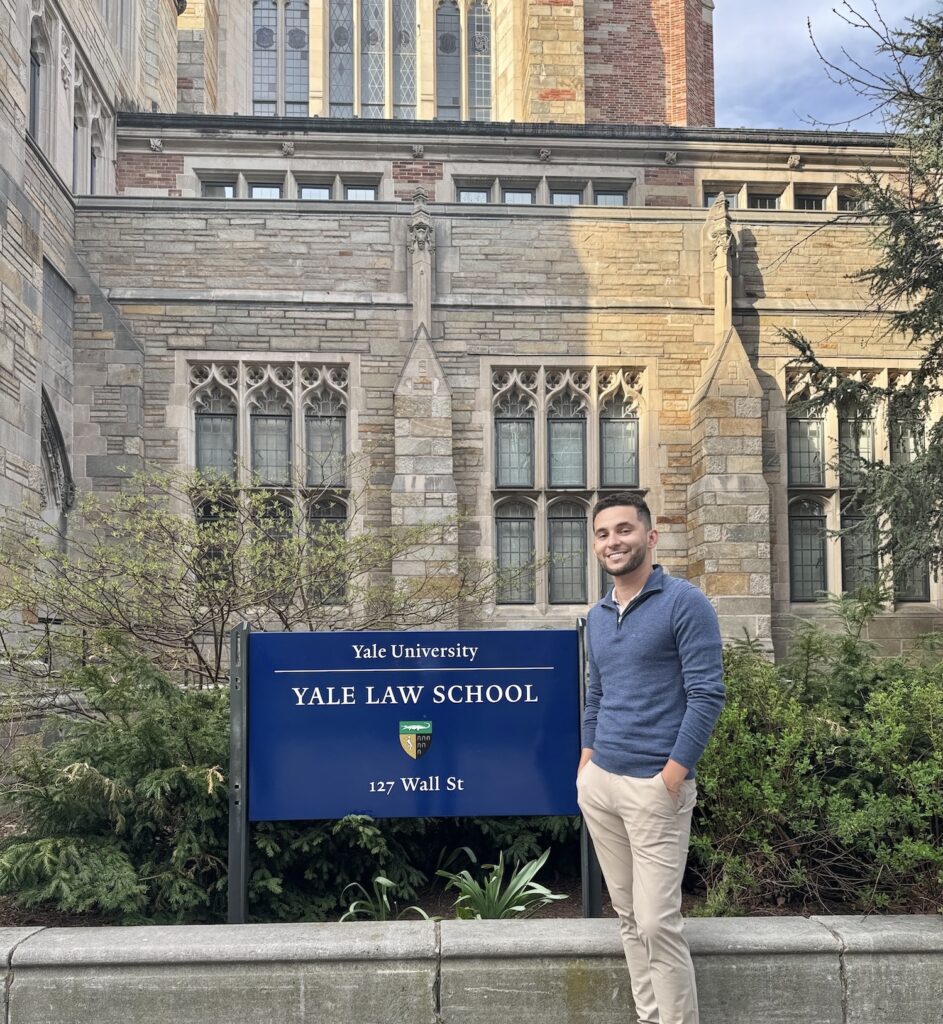Danilo standing outside of Yale Law School
